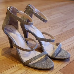 Metalltic strappy heels in excellent condition!